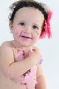 Cake smash shoot: Messy baby girl after eating birthday cake! Royalty Free Stock Photo