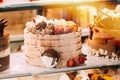 cake with strawberries, yummy assortment baked pastry in bakery. Various Different Types Of Sweet Cakes In Pastry Shop