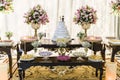 Cake table with sweets for wedding event