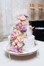 Cake traditional anniversary birthday wedding three-layer. White wedding cake with pink flowers for wedding banquet Royalty Free Stock Photo