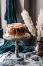 Cream cake on a wooden vintage stand.