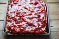 Cake with yoghurt and lemon layers with strawberries and jelly