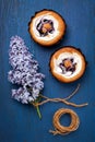 Cakes with berries and cream on blue background