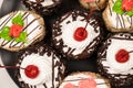 Cakes with chocolate, cherries and cream, top view