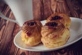 Cakes of cottage cheese with fruit jam, on an old wooden background