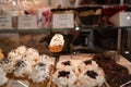 Cakes on display in patisserie shop window, Delicious pastries in coffee shop