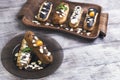 Cakes eclairs, mint, berries Physalis