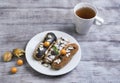 Cakes eclairs, mint, berries Physalis