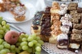 Cakes and fruit on the table. Party food. The table is prepared for a holiday party for guests Royalty Free Stock Photo