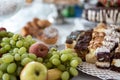 Cakes and fruit on the table. Party food. The table is prepared for a holiday party for guests Royalty Free Stock Photo