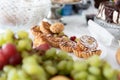 Cakes and fruit on the table. Party food. The table is prepared for a holiday party for guests Royalty Free Stock Photo