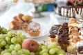 Cakes and fruit on the table. Party food. The table is prepared for a holiday party for guests Royalty Free Stock Photo