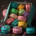 Cakes macaron or macaroon in blue box on rustic table, colorful bright cookies
