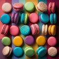 Cakes macaron or macaroon on striped background, colorful vibrant almond cookies, brightl colors