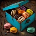 Cakes macaron or macaroon in wooden vintage box on rustic table, colorful bright cookies