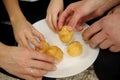 cakes on the plate custard children and adults reach for them many hands a plate of white cake take food delicious Royalty Free Stock Photo