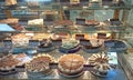 Cakes on the showcase of confectionery. Shop for sweet tooth Royalty Free Stock Photo