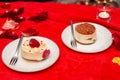 Cakes in white plates on a red tablecloth Royalty Free Stock Photo