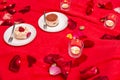 Cakes in white plates on a red tablecloth Royalty Free Stock Photo