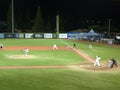 Cal State Northridge pitcher throws ball to UH Baseball players