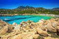 Cala Cipolla, Chia beach with red stones and azure clear water.