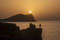 Cala Comte beach fisherman sunset Royalty Free Stock Photo