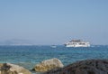 Cala Goloritze, Sardinia, Italy, September 8, 2020: A view of tourist cruise ship at turquoise blue water of Gulf of Orosei seen