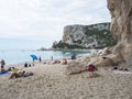 Cala Gonone, Sardinia, Italy, September 8, 2020: Cala Luna beach with sunbathing people and tourist. White sand beach