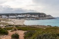 Cala Mesquida beach in Mallorca, Spain. Wild beach with dunes and hotels on a stormy day