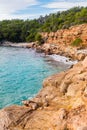 Cala Salada and Saladeta in san Antonio Abad at Balearic Islands Spain. Long exposure, Typical house for fishing boats and rocks. Royalty Free Stock Photo