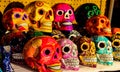 Calacas, wooden skull Day of the Dead masks on market in Cabo San Lucas, Mexico