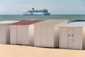 Beach cabins and P&O cross Channel ferry in Calais, France.