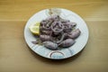Calamari with onion, lemon and oregani Royalty Free Stock Photo