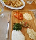 Calamari rings and variety of dips on restaurant table