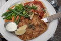 Calamari steak, pasta, pomodoro sauce and vegetables