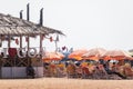 A tourist restaurant shack with chairs and umbrellas on the beach in North Goa Royalty Free Stock Photo