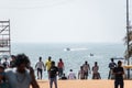 View of the sea from the crowded tourist beach in the town of Calangute in North Goa