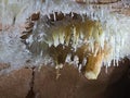 calcite crystals and stalactites inside a cave Royalty Free Stock Photo
