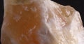 Calcite orange. Close-up stone texture. Panorama.