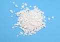 Calcium chloride on blue background Royalty Free Stock Photo