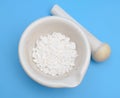 Calcium chloride on blue background Royalty Free Stock Photo