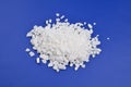 Calcium chloride on blue background Royalty Free Stock Photo