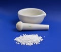 Calcium chloride on blue background Royalty Free Stock Photo