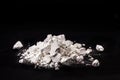 Calcium Chloride flakes, salt in solid state, used in brine for refrigeration machines, road dust and ice control, in cheese and Royalty Free Stock Photo