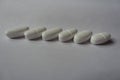 Calcium citrate nutritional supplement tablets in row