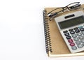 Calculater and glasses with book notes on white backgrounds