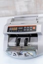 Calculating bank finance. Dollar cash counting machine. Money banknote counting equipment. Royalty Free Stock Photo