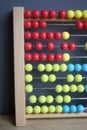 Calculating with beads on wooden rainbow abacus for number calculation. Mathematics learning concept Royalty Free Stock Photo