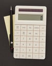 Calculator, adhesive note and pen Royalty Free Stock Photo