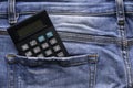 Calculator at the back pocket of blue jeans Royalty Free Stock Photo